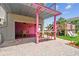Spacious outdoor patio with a covered dining area, bar and access to a playground and sun loungers at 3227 Rose Arbor Dr, Hernando Beach, FL 34607