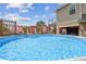 Backyard with an above-ground pool and deck, ideal for summer fun and relaxation at 3227 Rose Arbor Dr, Hernando Beach, FL 34607