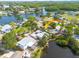 Waterfront home with dock, screened in area, and lush tropical landscaping at 328 Tallahassee Ne Dr, St Petersburg, FL 33702