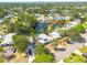 Waterfront home with dock, screened in area, and lush tropical landscaping at 328 Tallahassee Ne Dr, St Petersburg, FL 33702