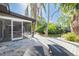 Backyard featuring lounge chairs, a deck, pond and tropical landscaping at 328 Tallahassee Ne Dr, St Petersburg, FL 33702