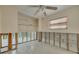Bedroom in need of renovation with opened walls, a ceiling fan and a window with blinds at 328 Tallahassee Ne Dr, St Petersburg, FL 33702
