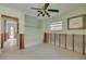 Bedroom in need of renovation featuring a ceiling fan, window and opened walls at 328 Tallahassee Ne Dr, St Petersburg, FL 33702