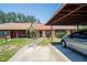 Charming single-story home with a well-maintained lawn, carport, and inviting entrance at 35145 Whispering Oaks Blvd, Dade City, FL 33523
