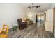 Cozy living room with plush seating, stylish lamps, and an open view into the adjacent sunroom at 35145 Whispering Oaks Blvd, Dade City, FL 33523