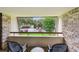 Relaxing balcony seating area overlooking lush greenery and parking at 36750 Us 19 N # 07208, Palm Harbor, FL 34684