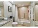 Clean bathroom featuring a tub with shower, tiled walls, and granite sink at 36750 Us 19 N # 07208, Palm Harbor, FL 34684