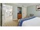 Bedroom offers closet, TV, easy access to a full kitchen, and neutral carpeting at 36750 Us 19 N # 07208, Palm Harbor, FL 34684