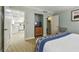 Bedroom offers closet, TV, easy access to a full kitchen, and neutral carpeting at 36750 Us 19 N # 07208, Palm Harbor, FL 34684