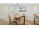 Bright dining area featuring a modern chandelier and easy access to the entryway at 36750 Us 19 N # 07208, Palm Harbor, FL 34684