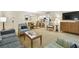 Cozy living room with a modern design and comfortable seating open to a kitchen and dining area at 36750 Us 19 N # 07208, Palm Harbor, FL 34684