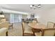 Cozy living room with plush seating, neutral décor, and balcony access at 36750 Us 19 N # 07208, Palm Harbor, FL 34684