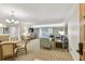 Bright living room with comfortable seating, neutral tones, and a balcony view at 36750 Us 19 N # 07208, Palm Harbor, FL 34684