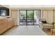 Well-lit living room with a view of the balcony through sliding doors at 36750 Us 19 N # 07208, Palm Harbor, FL 34684
