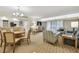Open concept living room and dining area filled with natural light, perfect for entertaining at 36750 Us 19 N # 07208, Palm Harbor, FL 34684