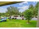 Picturesque parking lot view enhanced by a blue sky and lush green surroundings at 36750 Us 19 N # 07208, Palm Harbor, FL 34684