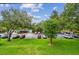 Scenic view of parking lot surrounded by lush trees and landscaping at 36750 Us 19 N # 07208, Palm Harbor, FL 34684
