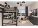 Unique bedroom with a loft bed, a built-in desk, and a modern soccer theme at 37224 Clinch Cir, Zephyrhills, FL 33540