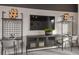 Living room showcasing a media center with storage, decorative shelves, and stylish decor at 37224 Clinch Cir, Zephyrhills, FL 33540