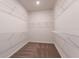 Spacious walk-in closet with shelving units ready to organize your wardrobe at 37224 Clinch Cir, Zephyrhills, FL 33540
