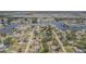 Wide aerial view of the property, revealing its location within a waterfront community with access to waterways at 402 12Th Sw St, Ruskin, FL 33570