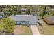 Aerial view showcasing a charming single-story home with boat parking, a well-manicured lawn, and a welcoming front porch at 402 12Th Sw St, Ruskin, FL 33570