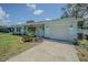 Charming single-story home with a manicured lawn and lovely curb appeal at 402 12Th Sw St, Ruskin, FL 33570