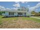 Charming single-story home with a manicured lawn and lovely curb appeal at 402 12Th Sw St, Ruskin, FL 33570
