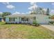 Charming single-story home with a manicured lawn and lovely curb appeal at 402 12Th Sw St, Ruskin, FL 33570