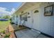 Inviting front porch with seating area, perfect for enjoying the outdoors at 402 12Th Sw St, Ruskin, FL 33570