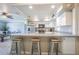 Modern kitchen with stainless steel appliances and a granite countertop island at 402 12Th Sw St, Ruskin, FL 33570