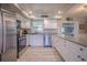 Well-equipped kitchen with white cabinetry and plenty of counter space at 402 12Th Sw St, Ruskin, FL 33570