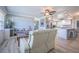 Open-concept living area with updated flooring and lots of natural light at 402 12Th Sw St, Ruskin, FL 33570