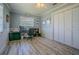 The office features wood-look flooring, a ceiling fan, wainscoting and a closet at 402 12Th Sw St, Ruskin, FL 33570