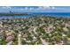 Picturesque aerial view of neighborhood near the bay with partial city skyline at 4291 Neptune Se Dr, St Petersburg, FL 33705