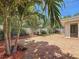 Private backyard and patio area bordered by white fencing and lush tropical foliage at 4291 Neptune Se Dr, St Petersburg, FL 33705