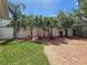 Spacious backyard and patio area with privacy fencing and mature landscaping at 4291 Neptune Se Dr, St Petersburg, FL 33705