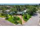 Corner lot home with mature trees, manicured lawn and circular brick driveway at 4291 Neptune Se Dr, St Petersburg, FL 33705