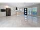 Bright kitchen featuring modern stainless steel appliances, white cabinets, and stone countertops at 4291 Neptune Se Dr, St Petersburg, FL 33705