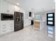 Bright, updated kitchen with stainless steel appliances and a center island with wood accents at 4291 Neptune Se Dr, St Petersburg, FL 33705