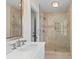 Bright bathroom featuring a glass enclosed shower, and a neutral-toned vanity at 455 18Th Ne Ave, St Petersburg, FL 33704