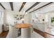 Open-concept dining room features a round table, stylish chandelier, and seamless flow into the modern kitchen at 455 18Th Ne Ave, St Petersburg, FL 33704