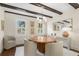Charming dining room with ample natural light, round table, seating, and decorative artwork at 455 18Th Ne Ave, St Petersburg, FL 33704