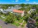Charming home with mature landscaping and a lush green lawn on a sunny day at 455 18Th Ne Ave, St Petersburg, FL 33704