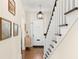 Bright foyer features hardwood floors, staircase, and transom windowed front door at 455 18Th Ne Ave, St Petersburg, FL 33704