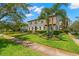 Stately home with a manicured lawn, mature landscaping, and a charming facade at 455 18Th Ne Ave, St Petersburg, FL 33704
