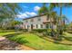 A stunning home boasts mature landscaping, vibrant greenery, and a welcoming facade at 455 18Th Ne Ave, St Petersburg, FL 33704