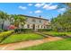 Well-maintained home featuring lush landscaping, a manicured lawn, and charming curb appeal at 455 18Th Ne Ave, St Petersburg, FL 33704
