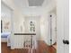 Bright upstairs hallway with hardwood floors and white accents leading to bedrooms at 455 18Th Ne Ave, St Petersburg, FL 33704