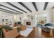 Stylish living room with exposed beams, fireplace, and hardwood floors at 455 18Th Ne Ave, St Petersburg, FL 33704
